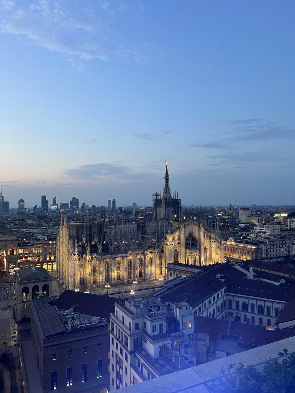 Milan Cathedral illuminated at dusk with the city skyline — AN Art Advisory Milan office