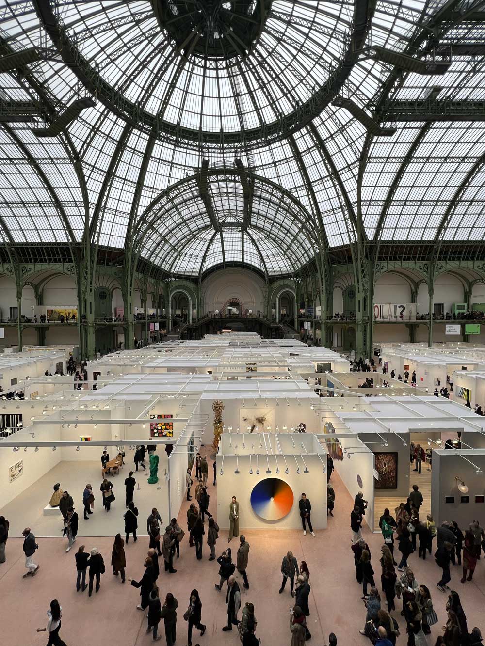 Art Paris fair seen from above under the Grand Palais glass and iron dome in Paris — art advisory at major international art fairs