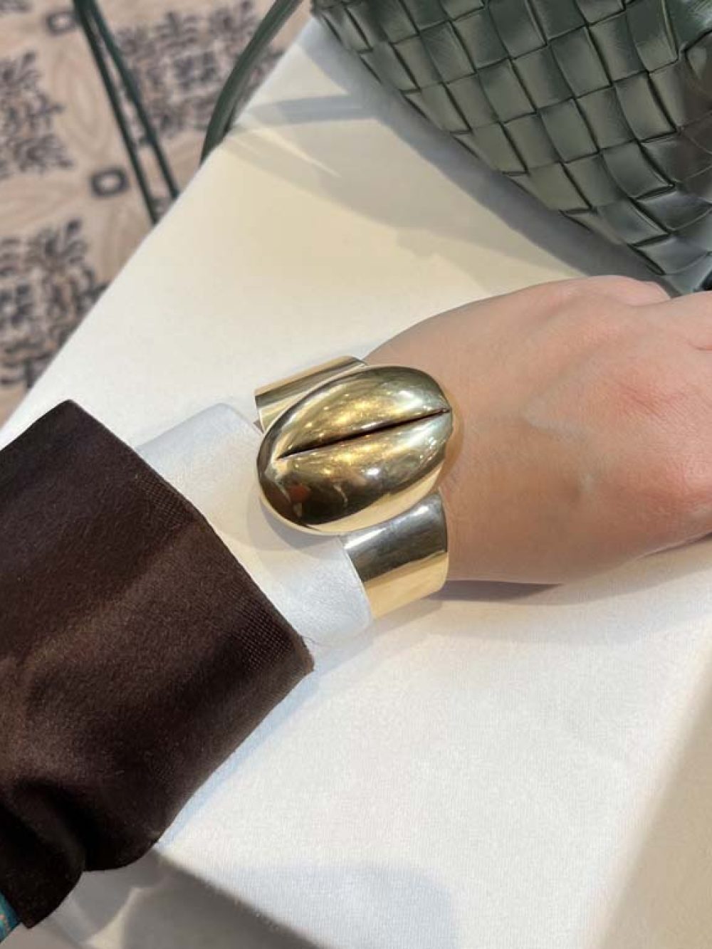 Large sculptural modernist gold cuff bracelet with organic pod-shaped design — fine jewelry advisory and collection