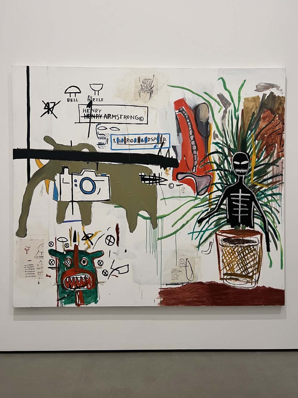 Neo-expressionist painting with symbolic figures and text displayed in a gallery — art appraisal and advisory